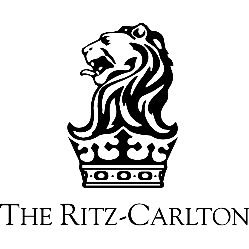 Logo of The Ritz-Carlton featuring a stylized lion's head above a crown, with the brand name beneath in elegant font.