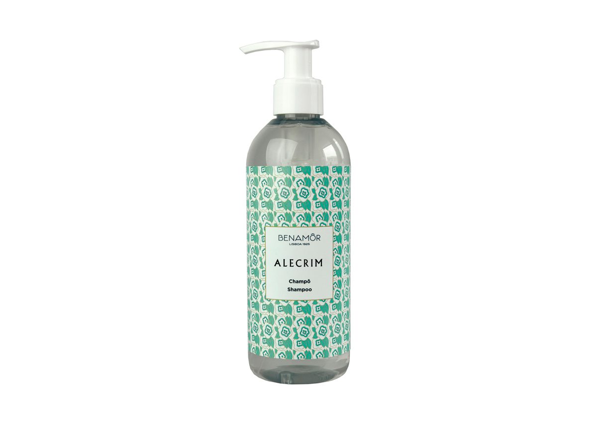 A transparent bottle of Alecrim shampoo with a decorative green and white patterned label and a pump dispenser on top.