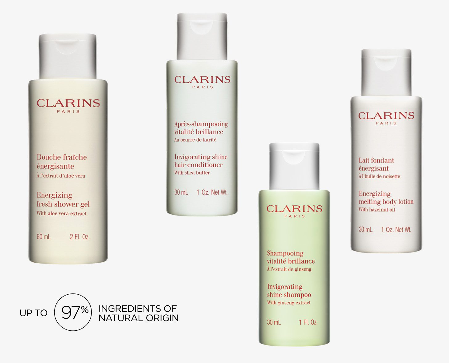 Four Clarins Paris personal care products are displayed: an energizing fresh shower gel, a shine enhancing conditioner, an uplifting shine shampoo, and a melting body lotion, each in sleek bottles with minimalistic design. The labels highlight the natural ingredients and their usage.