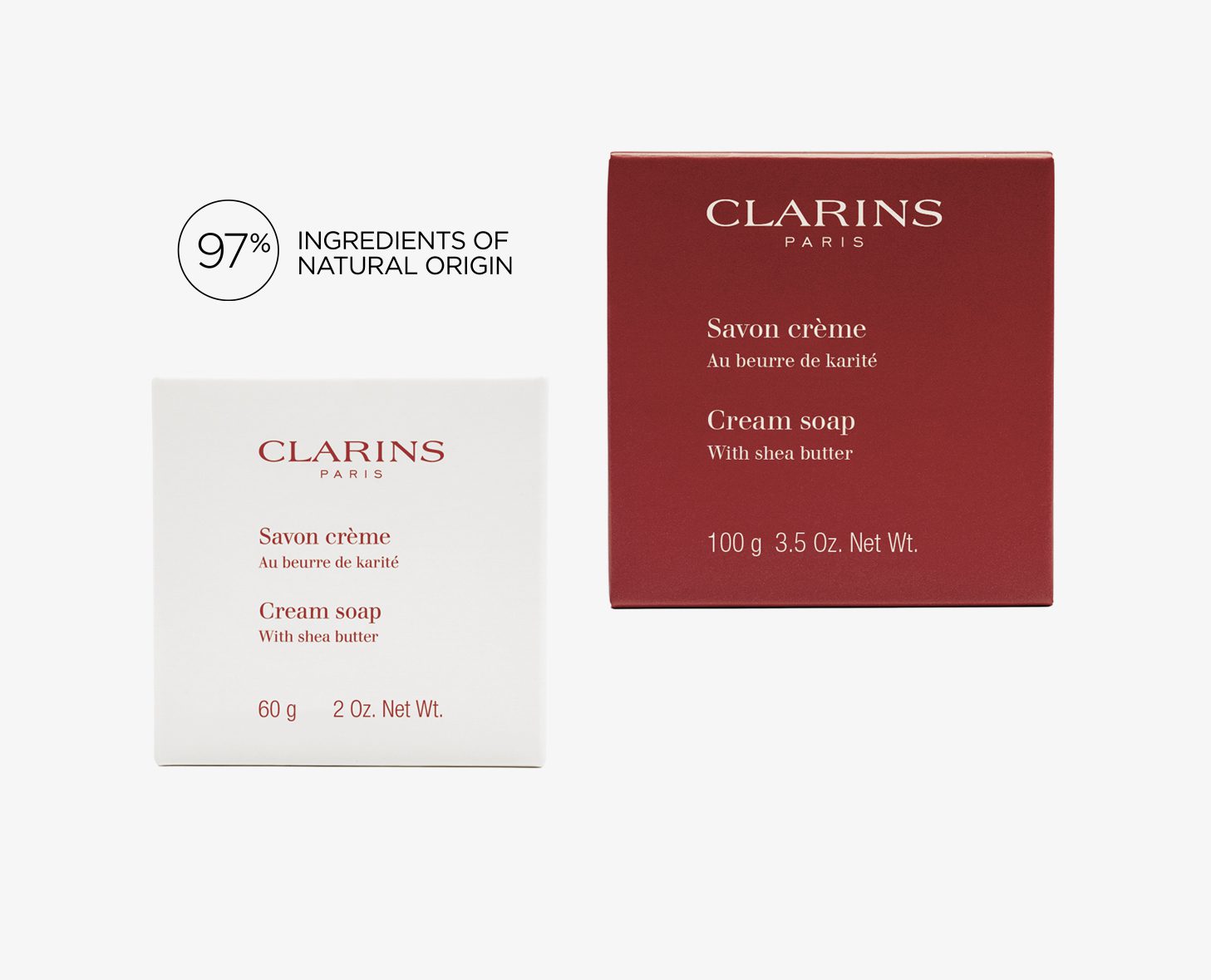 Two boxes of Clarins cream soap, one in white and the other in red, both highlighting their shea butter content and natural ingredient percentage of 97%.