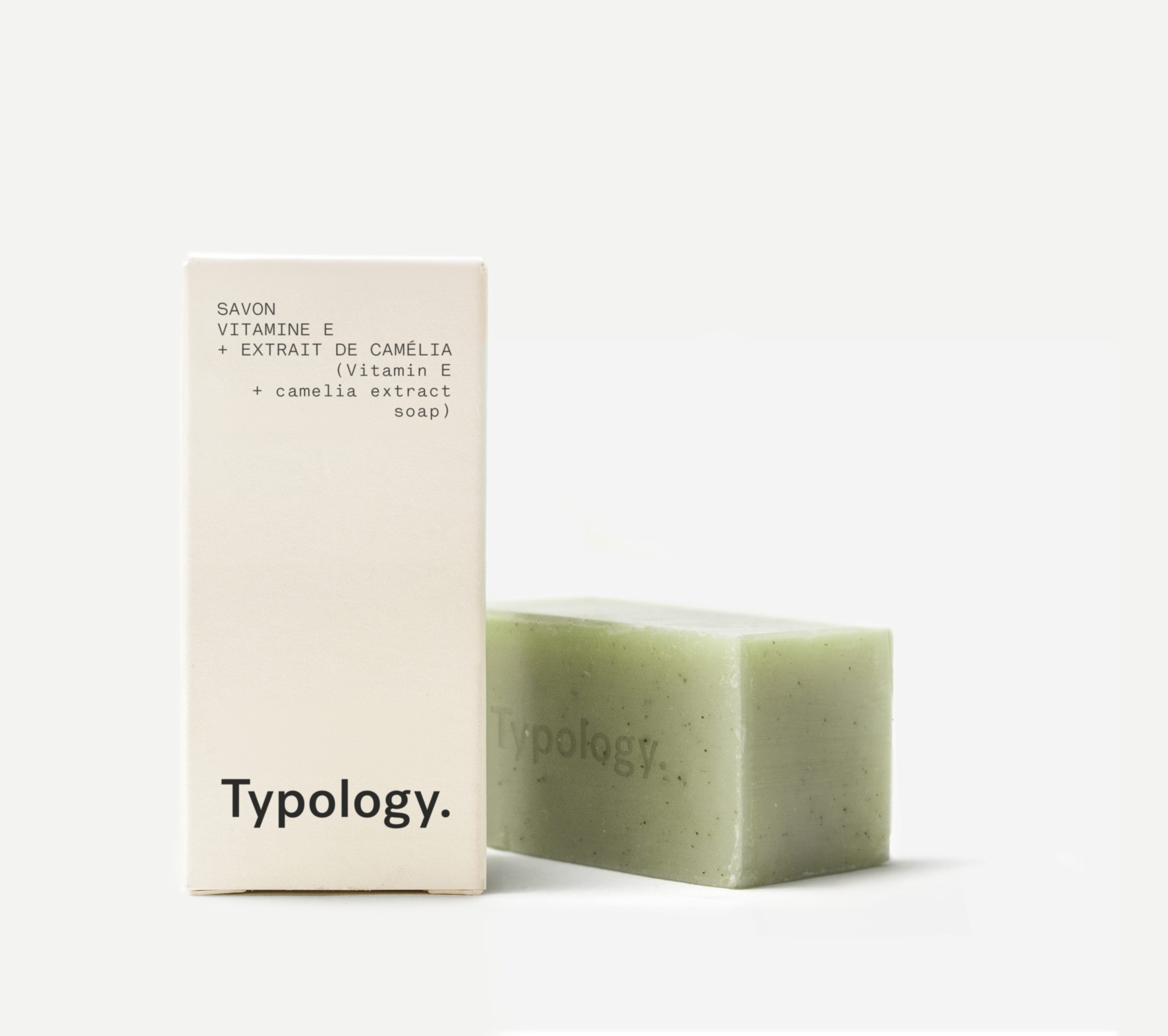 Typology vitamin E soap bar with packaging on white background