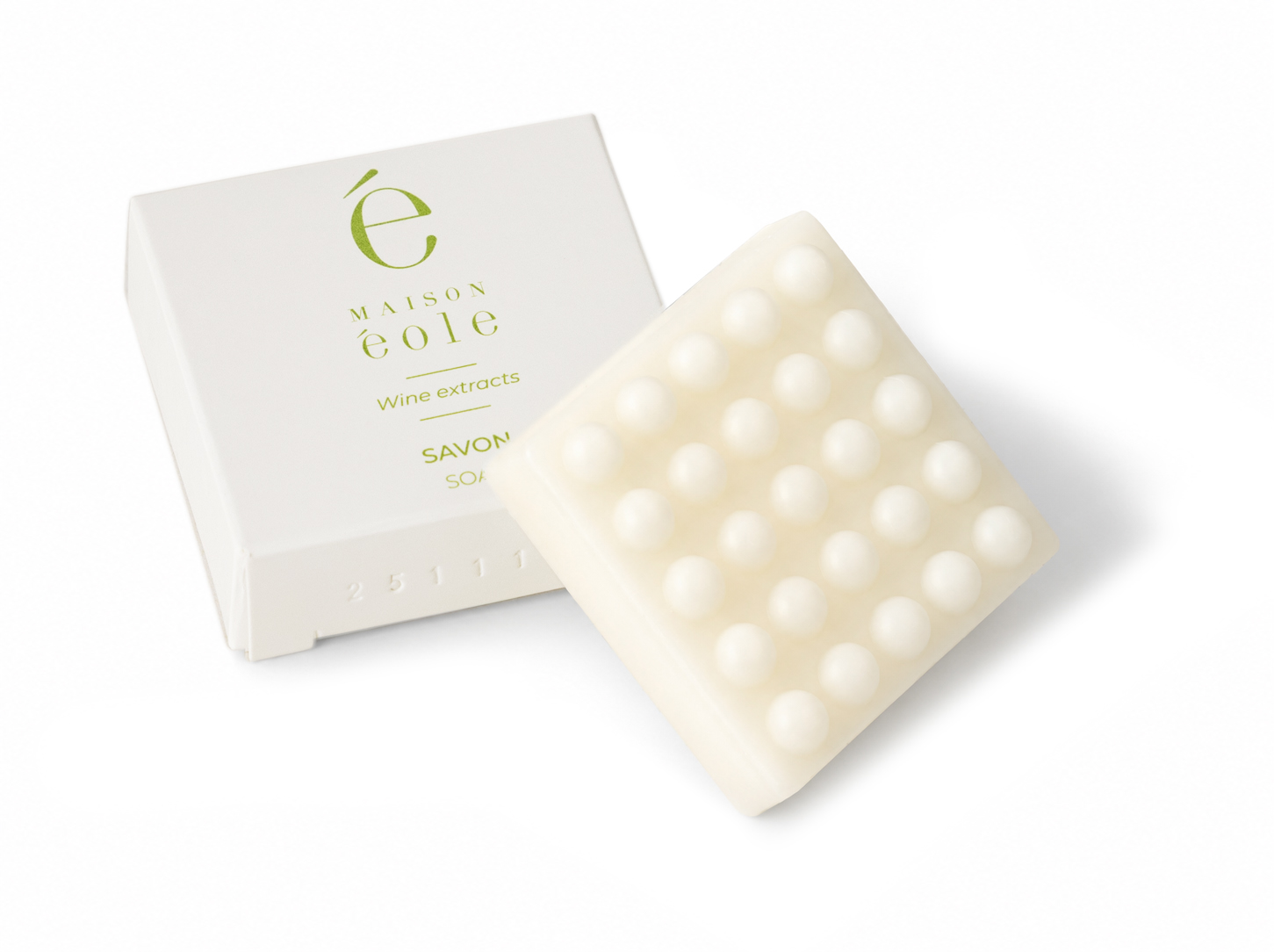 Maison Éole solid soap with white packaging and textured soap bar featuring rounded raised dots.