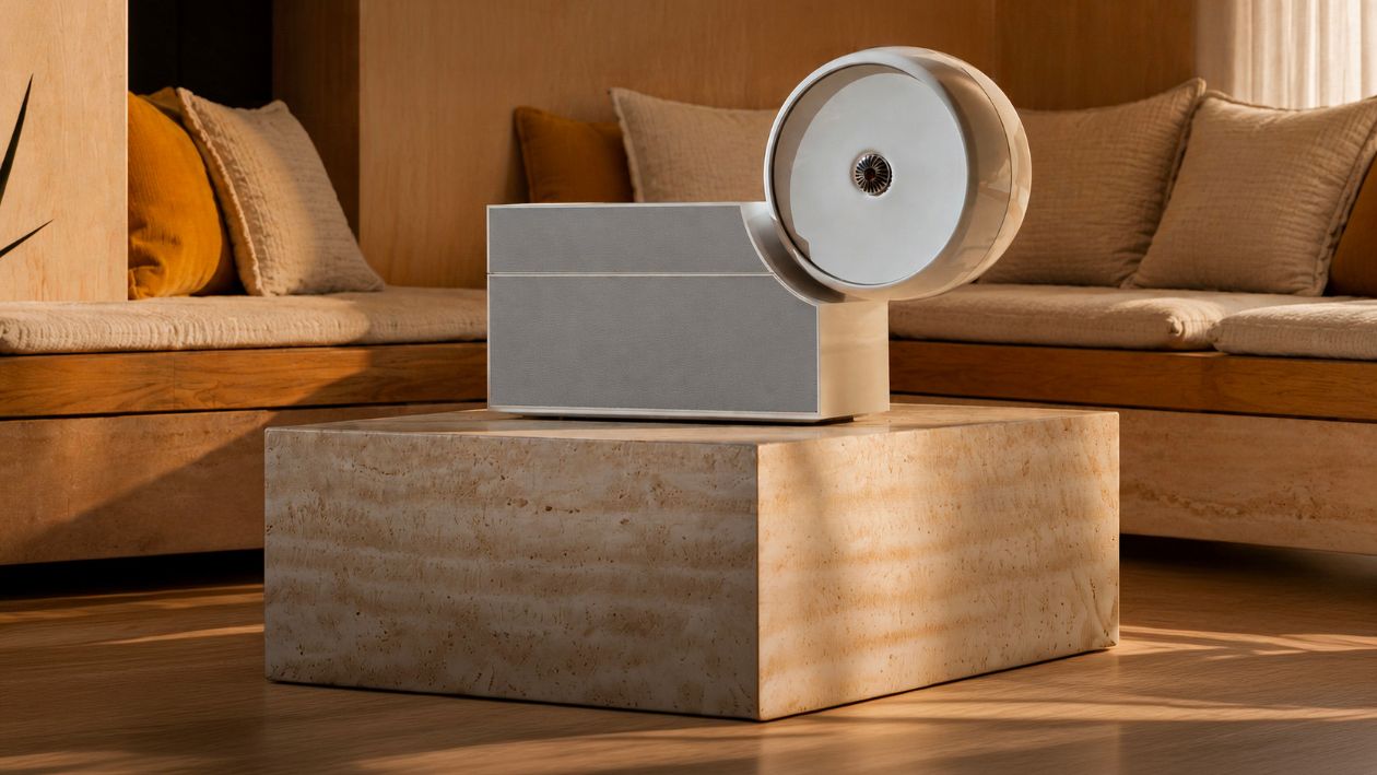 Modern luxury fragrance diffuser in a cozy, sunlit interior with sophisticated home décor.